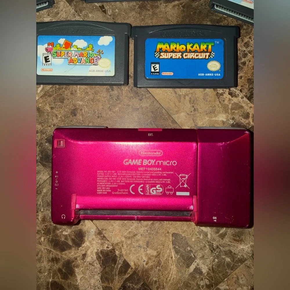 Pink Handheld Nintendo gameboy Micro with 5 games Mario Yoshi charger
